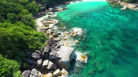 Aerial view of ocean waves, Beautiful tropical beach and rocky Stock Footage 123989397