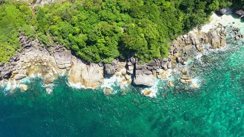 Aerial view of ocean waves, Beautiful tropical beach and rocky Stock Footage 123990746
