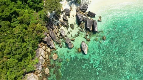 Aerial view of ocean waves, Beautiful tropical beach and rocky coastline and bea Stock Footage 123990929