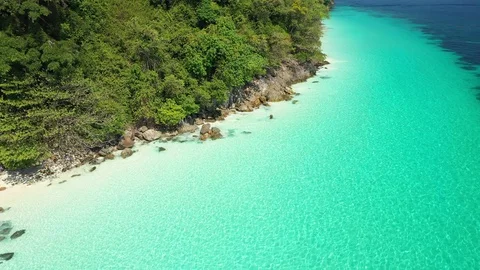 Aerial view of ocean waves, Beautiful tropical beach and rocky  Stock Footage 124910669