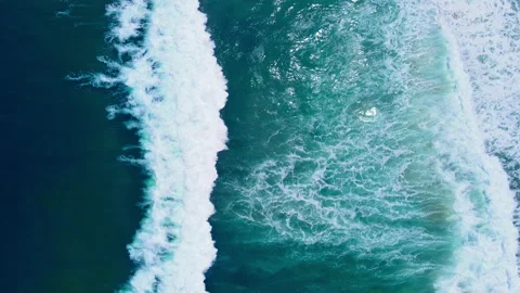 Aerial view to ocean waves. Blue water background Stock Footage 233772076