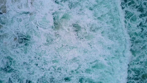 Aerial view to ocean waves. Blue water background Stock Footage 233772257