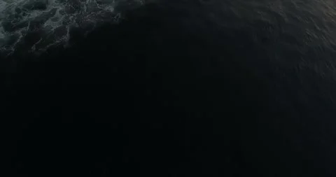 Aerial View of Ocean Waves Breaking in Rhythmic Motion Stock Footage 332150400