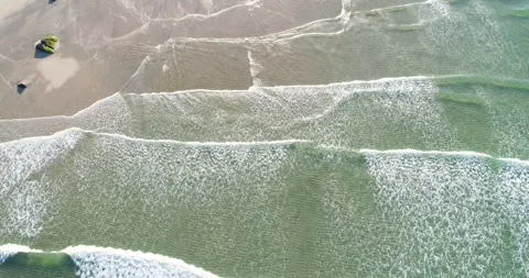 Aerial View of Ocean Waves Breaking on Shore] The Concept of Nature Video stock 333110965
