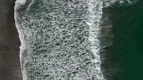Aerial View of Ocean Waves Breaking on Sandy Beach Stock Footage 341617859