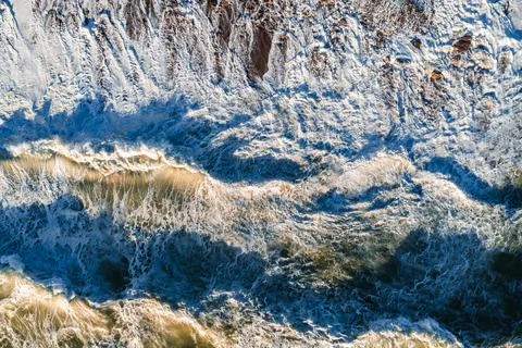Aerial view of ocean waves breaking on the coast of Swakopmund Стоковые фото