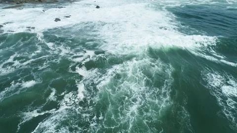 Aerial view of ocean waves crashing into white foam The Concept of raw nature Stock Footage 340125495