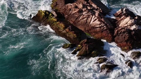 Aerial view of ocean waves crashing on rocks at La Palma in Cabo San Lucas Stock Footage 341482689
