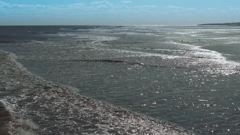 Aerial view of ocean waves crashing onto shore Stock Footage 346260122