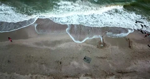 Aerial view of ocean waves creating white foam. 4k video Stock Footage 136612439