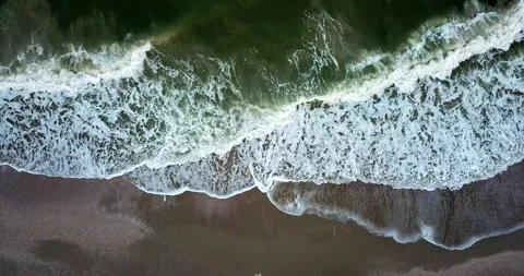 Aerial view of ocean waves creating white foam. 4k video Stock Footage 136612530