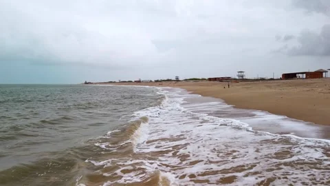 Aerial View of Ocean Waves Hitting Sandy Beach Shore with Blue Water Stock Footage 340553829