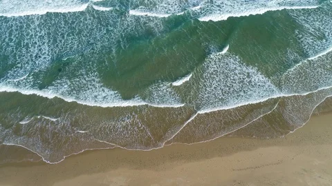 Aerial view of ocean waves on sandy beach, southern Africa Stock Footage 128618514