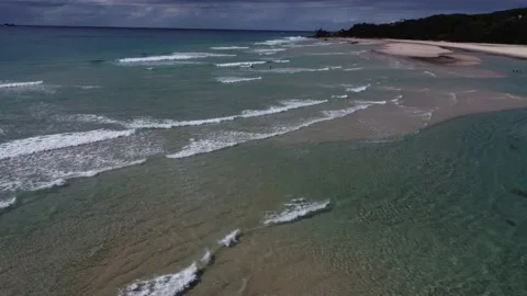 Aerial View Of Ocean Waves, Sandy Coastline In The Distance - Byron Bay Stock Footage 239575920