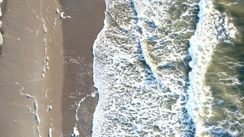 Aerial view of ocean waves on sandy beach Stock Footage 324497428