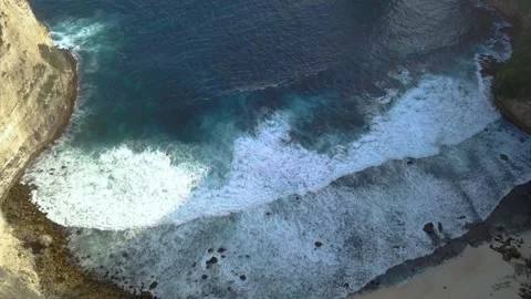 Aerial view of ocean waves splash against rocks. Travel adventure, Nusa Penida Video stock 220304605