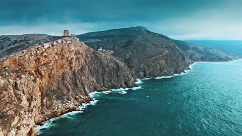 Aerial view of ocean waves splashing in rocks Stock Footage 147934571