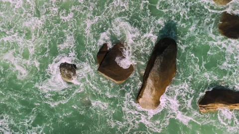 Aerial view of ocean waves texture with big rocks Stock Footage 331229660