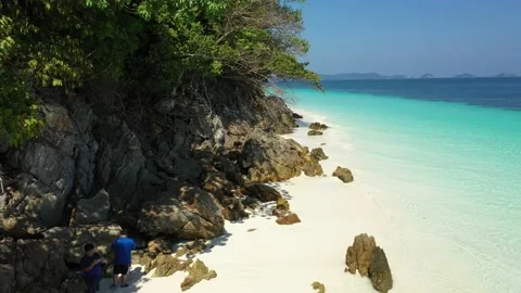 Aerial view of the ocean waves, white beaches and clear blue water and beautiful Stock Footage 130661391