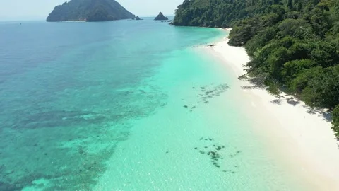 Aerial view of the ocean waves, white beaches and clear blue water Stock Footage 131627539