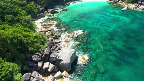 Aerial view of the ocean waves, white beaches and clear blue water and beautiful Stock Footage 132114239