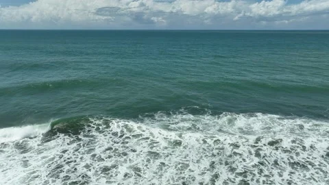 Aerial View of Ocean Waves with White Foam Stock Footage 234408320