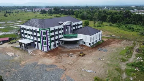 Aerial view of an office building under construction surrounded by agricult.. Stock Footage 317545909