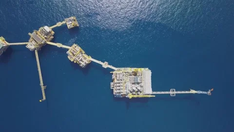 Aerial view of offshore Central Processing Production Platforms Stock Footage 137679306