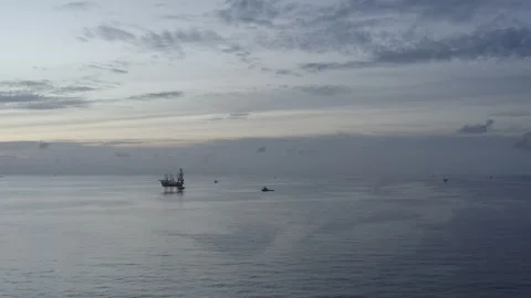 Aerial view of offshore jack up rig and offshore platform during sunset Stock Footage 320267673