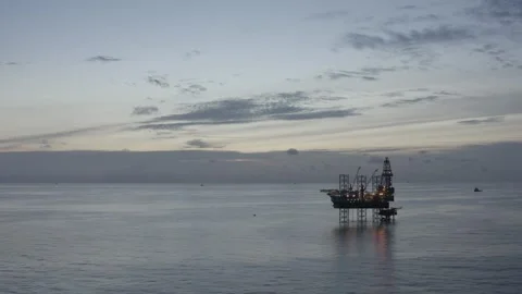 Aerial view of offshore jack up rig and offshore platform during sunset Stock Footage 320267685