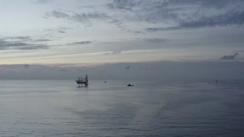 Aerial view of offshore jack up rig and offshore platform during sunset Stock Footage 320267688