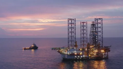 Aerial view of offshore jack up rig and offshore platform during sunset Stock Footage 320587784