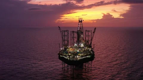 Aerial view of offshore jack up rig and offshore platform during sunset Stock Footage 320655873