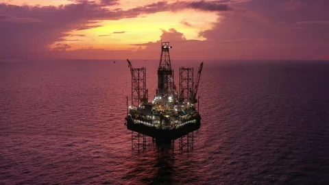 Aerial view of offshore jack up rig and offshore platform during sunset Stock Footage 320655878