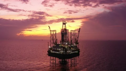 Aerial view of offshore jack up rig and offshore platform during sunset Stock Footage 320655883