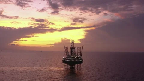 Aerial view of offshore jack up rig and offshore platform during sunset Stock Footage 320655949