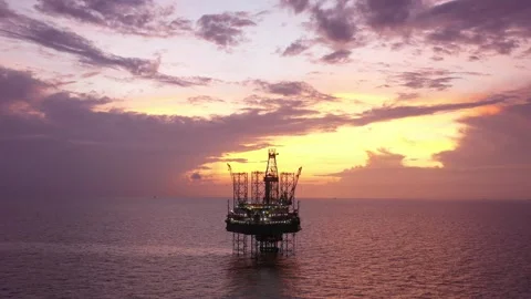 Aerial view of offshore jack up rig and offshore platform during sunset Stock Footage 320655957
