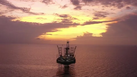 Aerial view of offshore jack up rig and offshore platform during sunset Stock Footage 320655960