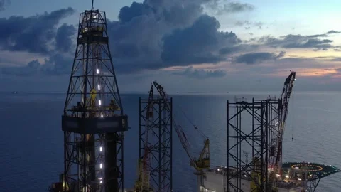 Aerial view of offshore jack up rig and offshore platform during sunset Stock Footage 320656452