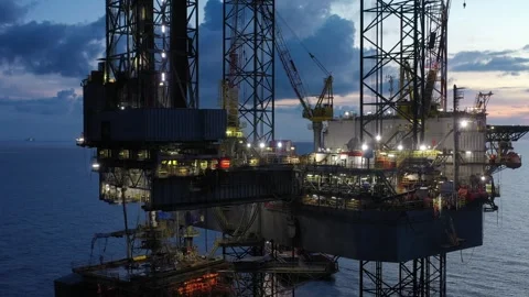 Aerial view of offshore jack up rig and offshore platform during sunset Stock Footage 320656471