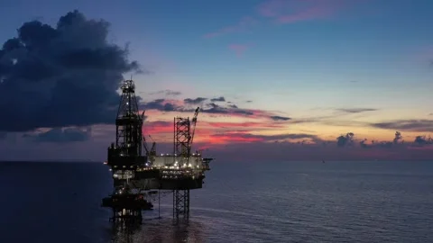 Aerial view of offshore jack up rig and offshore platform during sunset Stock Footage 320656602