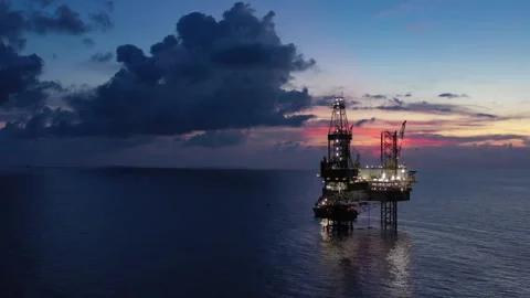 Aerial view of offshore jack up rig and offshore platform during sunset Stock Footage 320656606
