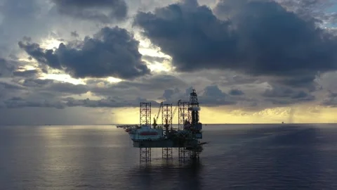 Aerial view of offshore jack up rig and offshore platform during sunset Stock Footage 320969996