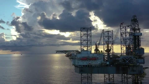 Aerial view of offshore jack up rig and offshore platform during sunset Stock Footage 320970033