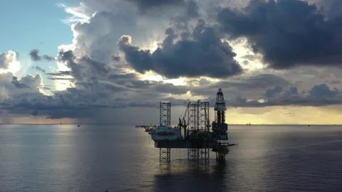 Aerial view of offshore jack up rig and offshore platform during sunset Stock Footage 320970034