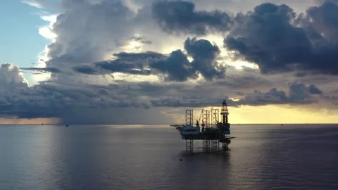 Aerial view of offshore jack up rig and offshore platform during sunset Stock Footage 320970167