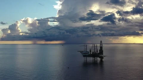 Aerial view of offshore jack up rig and offshore platform during sunset Stock Footage 320970177
