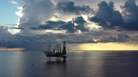 Aerial view of offshore jack up rig and offshore platform during sunset Stock Footage 320970201