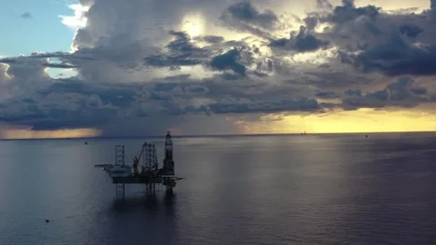 Aerial view of offshore jack up rig and offshore platform during sunset Stock Footage 320970249