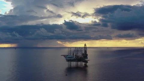 Aerial view of offshore jack up rig and offshore platform during sunset Stock Footage 320970250